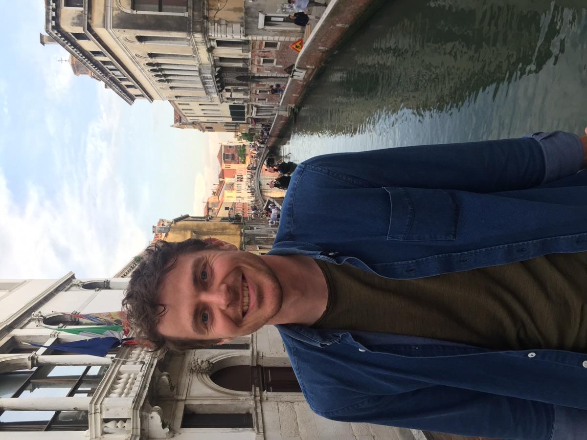 Zachary Hamaker smiling beside a canal
